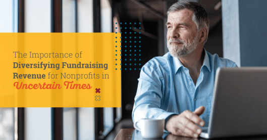 Man sitting at table with laptop and coffee