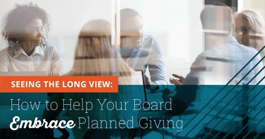 Photo taken of a meeting with three women and two men. Slight glass glare implies the picture is taken outside the meeting room looking in through the window. Text at the bottom of the image says "Seeing the Long View: How to Help Your Board Embrace Planned Giving"
