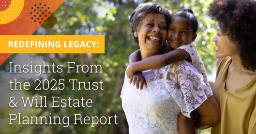 Photo of two African American women and a young girl (mother, daughter and granddaughter) outside on a sunny day. The woman on the far right is in her late 20s-early 30s and has curly hair styled like a larger afro. She is wearing a yellow long sleeve blouse and is smiling at her mother. The older woman has short straight grey hair and is wearing a white blouse with floral lace on the sleeves and upper neckline. She is carrying the smiling young girl on her back who is wearing a white polka dot dress and slicked back ponytail. Text to the left of the photo says "Redefining Legacy: Insights From the 2025 Trust & Will Estate Planning Report."